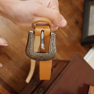 Brown leather western belt with silver hardware